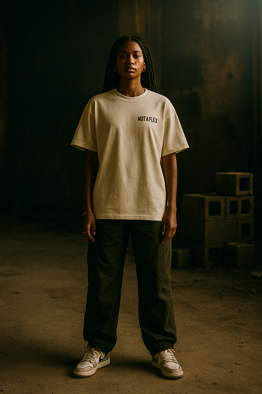 Model wearing Crowns Down The Confession Tee in abandoned building, looking straight to camera