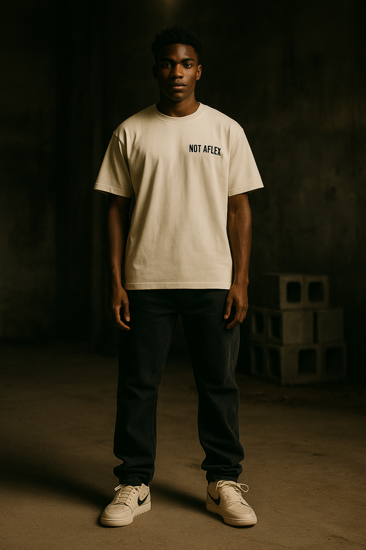 Model wearing Crowns Down The Confession Tee in abandoned building, looking straight to camera